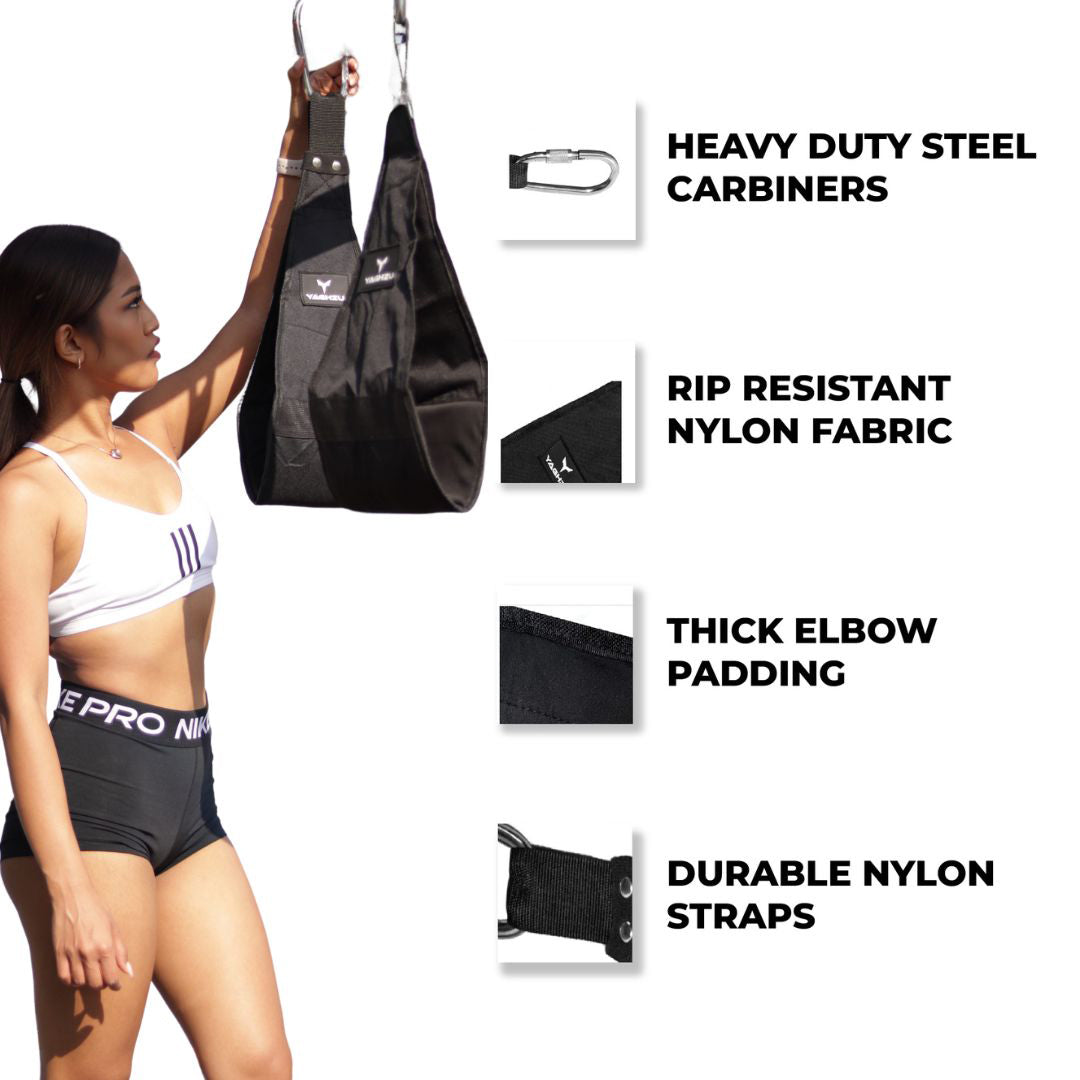 Woman showcasing Yaghzu black hanging ab straps with heavy-duty steel carabiners, rip-resistant nylon fabric, thick elbow padding, and durable straps for core and ab workouts. Ab arm slings attached to pull-up bar for hanging exercises.