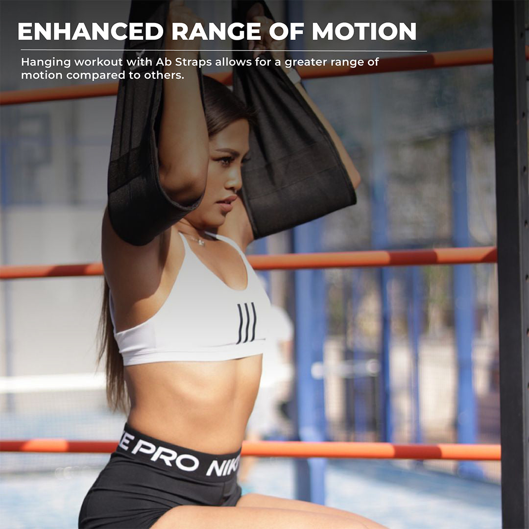 Woman performing hanging ab workout with Yaghzu black ab straps to increase range of motion and strengthen core muscles