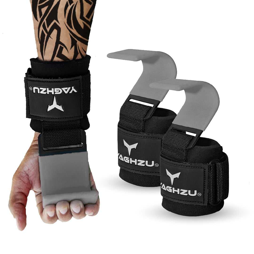 Yaghzu grey weight lifting hooks shown on a tattooed forearm and separately as a pair, featuring padded wrist support, strong steel hooks, and adjustable Velcro straps for secure grip during heavy lifts.