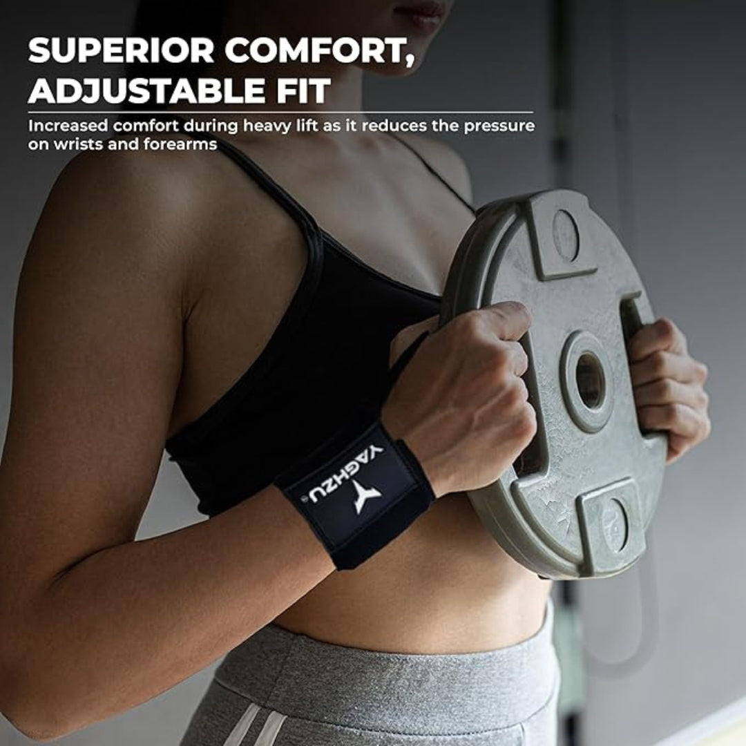 Woman wearing black Yaghzu wrist wraps while holding a weight plate, highlighting superior comfort and adjustable fit for reduced wrist and forearm pressure during heavy lifting workouts