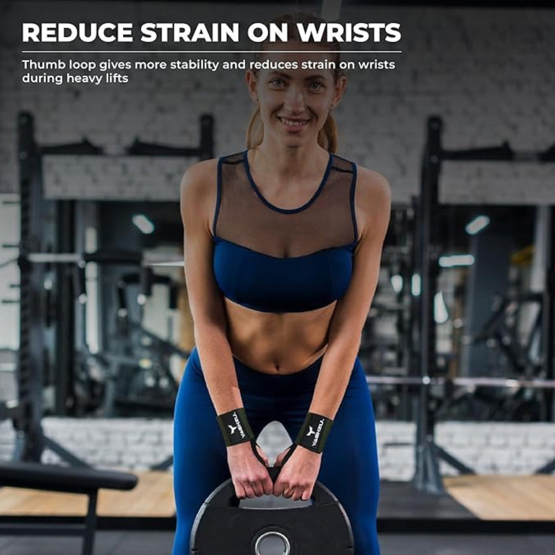 Woman lifting a weight plate in a gym wearing green Yaghzu wrist wraps, designed with a thumb loop to reduce wrist strain and enhance stability during heavy lifts