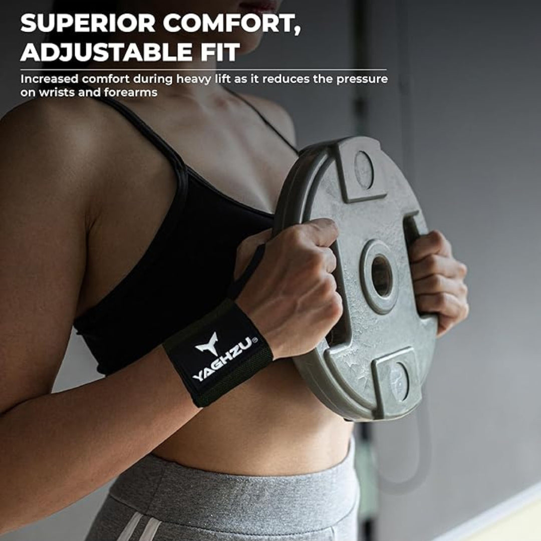 Woman wearing green Yaghzu wrist wraps while holding a weight plate, highlighting superior comfort and adjustable fit for reduced wrist and forearm pressure during heavy lifting workouts