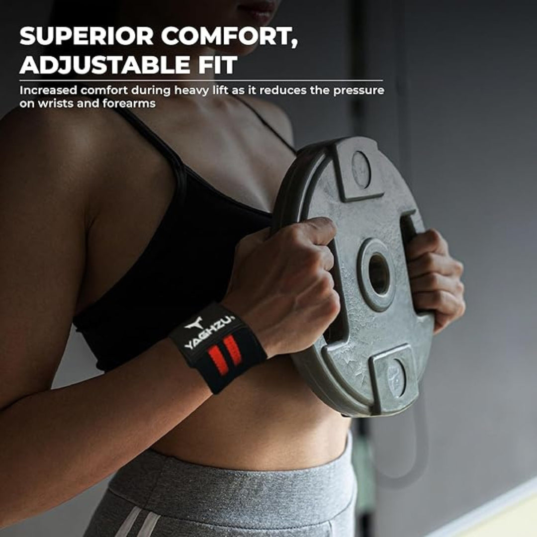 Woman wearing red Yaghzu wrist wraps while holding a weight plate, highlighting superior comfort and adjustable fit for reduced wrist and forearm pressure during heavy lifting workouts